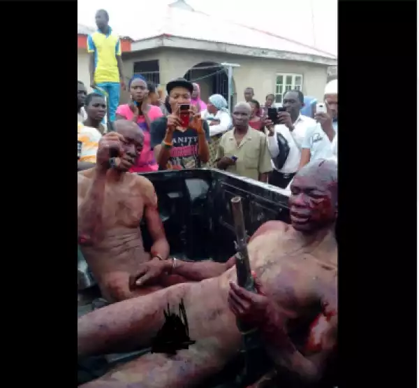 Graphic Photos: See How Angry Mob Stripped & Beat Armed Robbers In Ogun